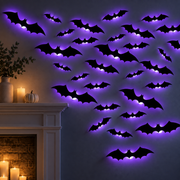 Purple LED Halloween bat wall lights glowing at night above a modern fireplace